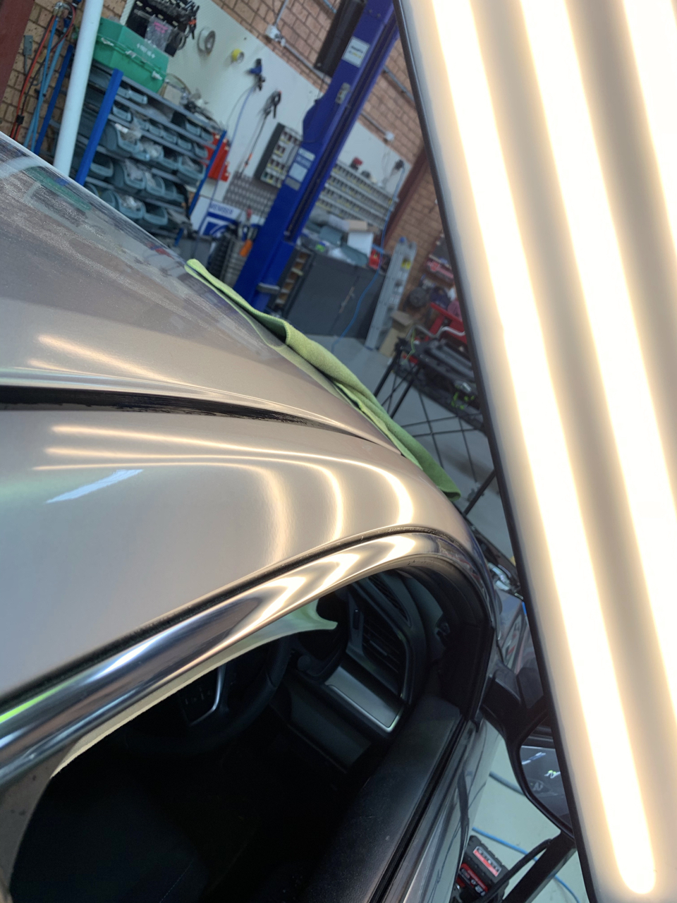 After photo showing the upper door and roof edge repaired by Dent X